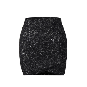 Detail of black mini skirt featuring white splatter print and elastic high-waisted fit