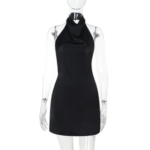 Detailed view of black satin halter mini dress with sleek slim fit on model