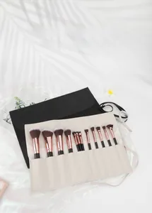 Detail of lychee pattern PU leather brush roll and professional 12-piece brush set