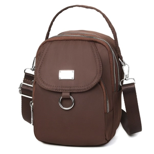 Brown nylon crossbody bag with three zipper compartments and adjustable shoulder strap