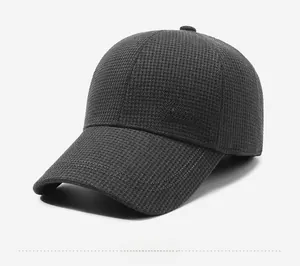 Detailed side view of charcoal grey plaid baseball cap with Slate embroidery detail