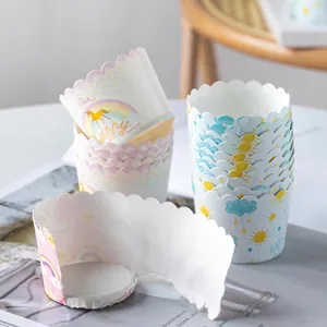 Stack of 50 disposable muffin cups with colorful rainbow and unicorn prints for baking