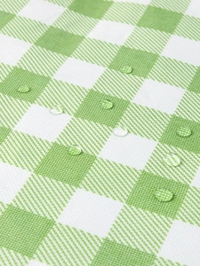 Waterproof green checkered picnic mat with water droplets on high-quality fabric