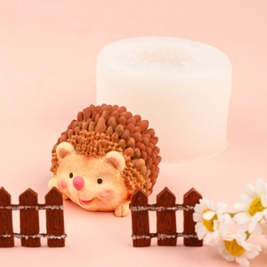 3D hedgehog silicone mousse cake mold with finished brown hedgehog figure on pink background