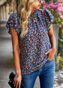 Close-up of blue floral print and ruffle sleeves on loose casual summer top blouse