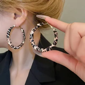 Fashionable leopard print fabric wrap hoop earrings with gold finish for women