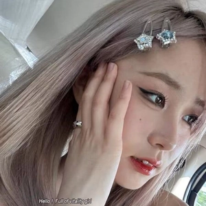 Sparkling pink rhinestone star hair clips and silver ring set worn by a model