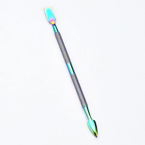 Macro view of rainbow titanium dual-head cuticle pusher tool with knurled non-slip handle