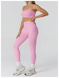 Detail view of pink seamless yoga set featuring high-waisted leggings and sports bra