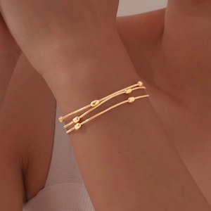 Minimalist Stainless Steel Three Layer Snake Bone Chain Bracelet For Women Gold Electroplated Oval Bead Adjustable Bracelet