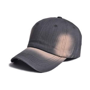 Detail of grey tie-dye baseball cap featuring gradient wash and six-panel structure