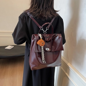 Vintage dark red leather backpack with silver lock and bear pendant for women's daily commute