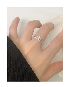 Detail of silver S925 double-layer star ring with micro-set zircon on hand