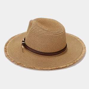 Women's wide brim straw sun hat with leather belt and frayed edges for beach vacations