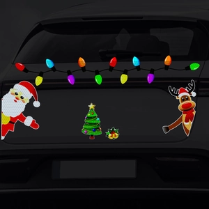 Reflective Christmas magnetic stickers showing Santa and reindeer on a black car rear