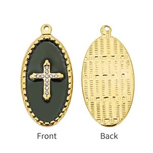 Front and back detail of an oval 18k gold plated cross pendant with cubic zirconia
