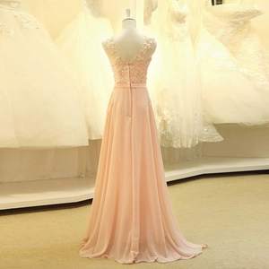 Pink lace and chiffon evening gown featuring an elegant V-back design and floral applique