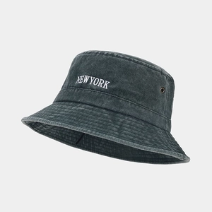 Detailed view of New York embroidery on a vintage charcoal washed cotton bucket hat