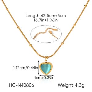 Detail view of blue cat eye heart pendant necklace with dimensions and weight info
