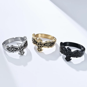 Detailed view of Celtic eternal knot eagle rings in silver, gold, and black finishes