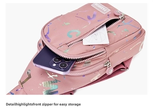 Detailed view of pink crossbody bag main zipper pocket showing internal storage space