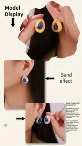 Détail de boucles d'oreilles larmes vintage avec pierre bleue et métal doré texturé