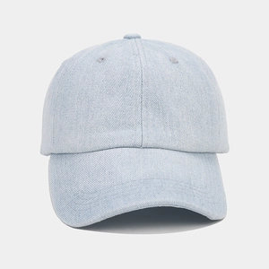 Front view of light blue denim baseball cap with six-panel structure and curved brim