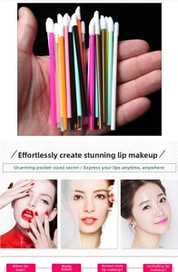 Macro view of assorted colorful disposable lip brushes with soft white flocked tips