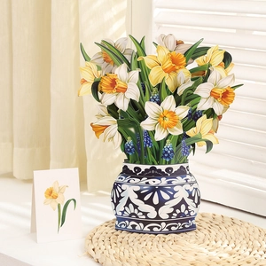 Detail of 3D popup Mother's Day card featuring yellow daffodils in a blue patterned vase
