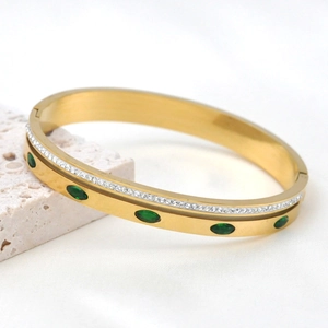Golden stainless steel bangle with green marquise stones and micro-pave star detailing