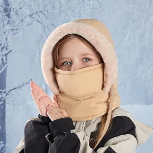 Beige kids windproof earflap hat with warm plush lining in winter snow scene
