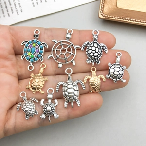 Antique silver and gold sea turtle pendants in various sizes and finishes for DIY jewelry