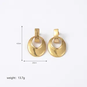 Detailed view of large gold-tone irregular geometric earrings with size measurements