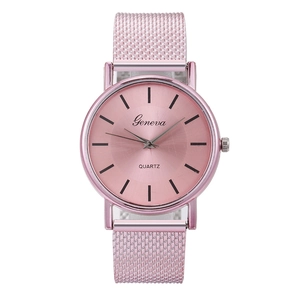 Detail of pink quartz watch featuring a round dial and adjustable metal mesh strap