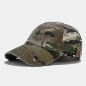 Detail view of multicam camouflage baseball cap with breathable eyelets and curved brim
