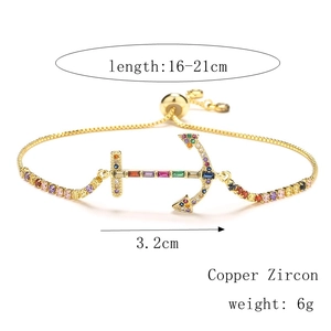 Detail of adjustable gold anchor bracelet with colorful micro-pave zircon crystals
