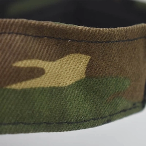 Macro shot of camouflaged polyester fabric strap showing high-quality stitching detail