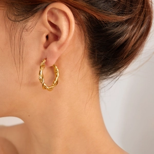 Fashionable gold twisted hoop tassel earrings for women made of durable stainless steel