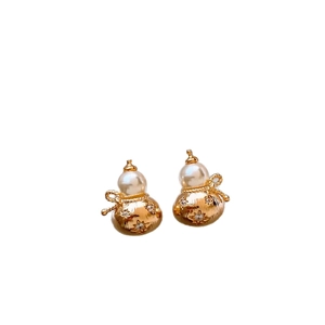 Gourd-shaped gold stud earrings with white pearl top and sparkling starburst accents