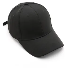 Top view detail of the black cotton baseball cap showing the six-panel crown and eyelets