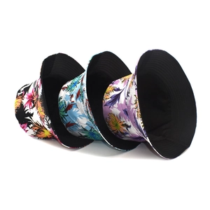 Reversible tropical floral bucket hats in red, blue, and purple for outdoor sun protection