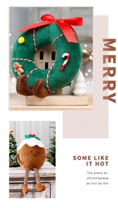 Detail of plush Christmas mushroom wreath and long-legged doll ornaments in cozy lighting