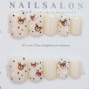 Cute bear and heart pattern press-on nails with cream base and polka dot accents
