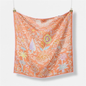 Detail of square silk scarf with floral hand-painted pattern and vibrant nature elements