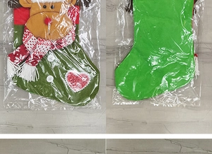 Detailed front and back view of a green knit Christmas stocking with a 3D reindeer doll