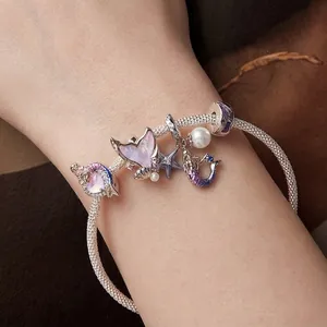 S925 sterling silver mermaid tail bracelet with enamel charms and white pearl on wrist