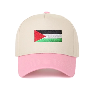 Close-up of embroidered flag patch on two-tone beige and pink baseball cap