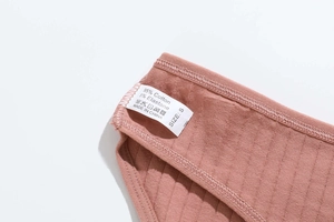 Macro detail of breathable cotton rib knit fabric with washing label for women panties