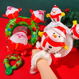 Christmas wrist and headband balloons featuring Santa and Snowman for festive party events