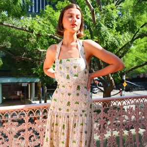 Detailed view of the halter neck palm tree print dress featuring a square neckline